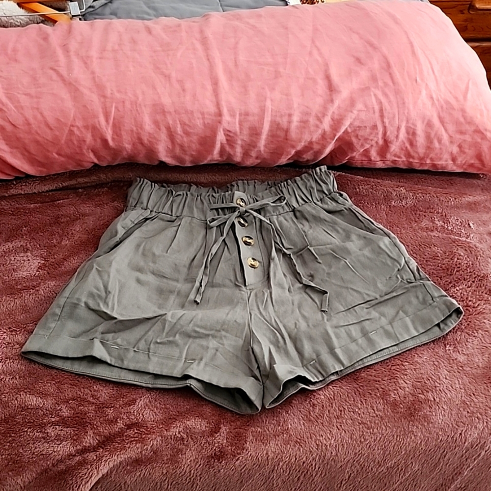 New, never worn high waisted army green shorts.